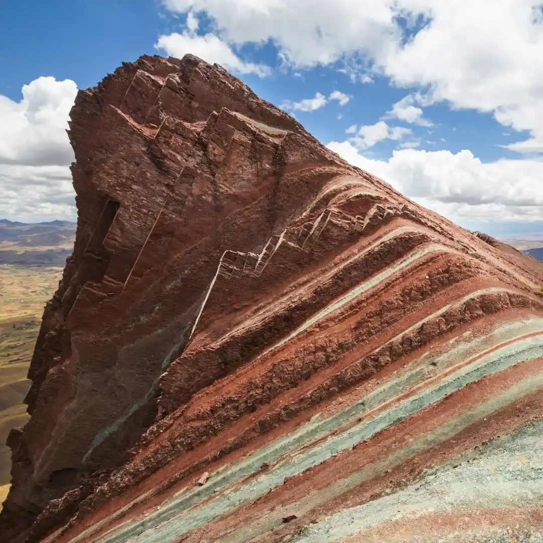 Trekking group hiking toward Pallay Punchu mountain at sunrise