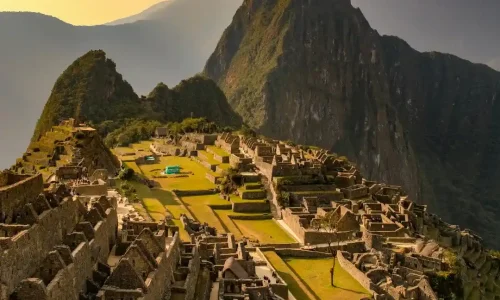 Traveler walking along the Inca Trail with panoramic Andes backdrop